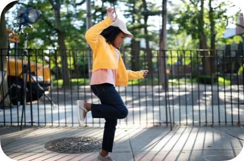 Girl playing hopscotch in a playground